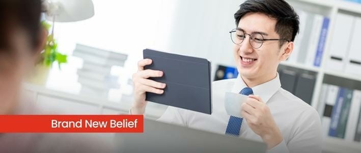 Asian Man With Glasses Looking At Tablet